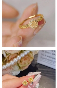 Detail of yellow cushion-cut crystal ring and earrings with halo diamond settings