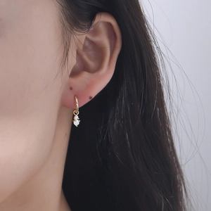 Elegant gold S925 sterling silver hoop earrings with clear zircon stones on ear