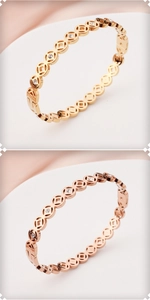 Detail of hollow coin pattern bangle with rhinestones in gold and rose gold finish