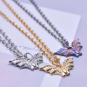 Three 18K stainless steel bat necklaces in silver, gold, and rainbow finish