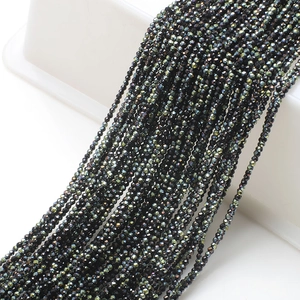 Macro detail of dark grey faceted glass beads for DIY jewelry and accessory making