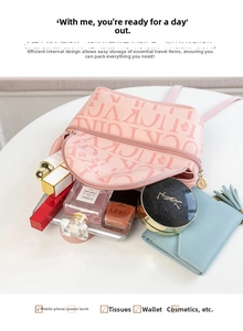 Pink printed mini backpack showing interior capacity for phone and cosmetics