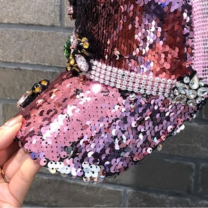 Detail of hand-set rhinestones and gradient sequins on a breathable mesh baseball cap
