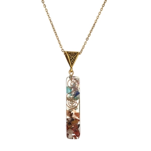 Minimalist Orgone necklace featuring colorful natural stones and copper coil in resin