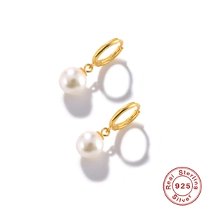 Detail view of 925 sterling silver hoop earrings with white freshwater pearls