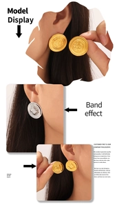 Macro detail of vintage gold and silver embossed round stud earrings with relief texture