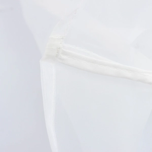 Detailed view of white organza fabric stitching and texture for sweet short sleeve blouse