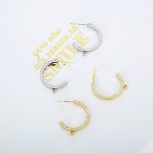 Gold and silver half-hoop earring findings with inlaid crystals and small hanging loops