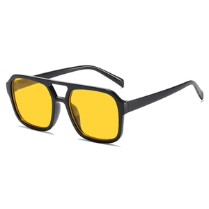Retro black pilot sunglasses with bright yellow lenses and double bridge frame style