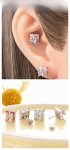 Macro view of gift box bow stud earrings with zircon inlay and screw back design