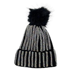 Detail view of black knit beanie featuring sparkling rhinestones and a large faux fur pom