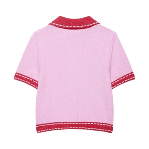 Pink knit short-sleeve polo top with red collar and striped trim, back view details