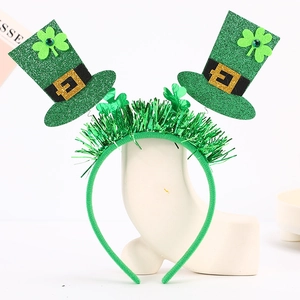 Detail of St. Patrick's Day headband with green sequin mini hats and shamrock patterns