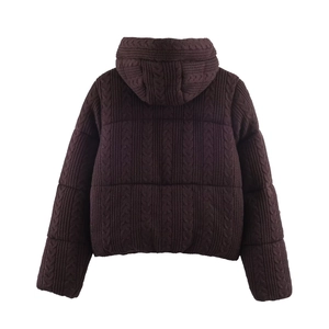 Women's dark burgundy cable knit hooded puffer coat showing back view texture and style