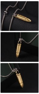 Detailed views of a brass-tone bullet pendant with a silver-colored metal chain