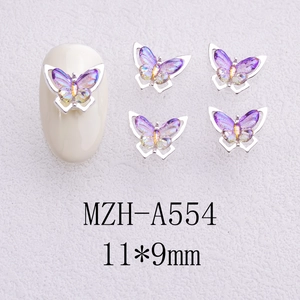 Detailed view of silver butterfly nail charms with purple gradient resin 11x9mm