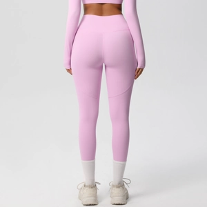 Rear view of high-waisted yoga leggings in soft pink with body-shaping stitch detail