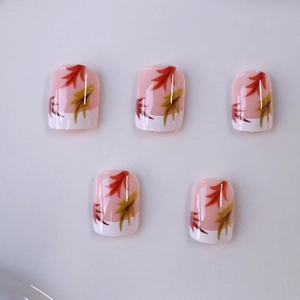 Short square French press-on nails with autumn maple leaf design and glossy finish