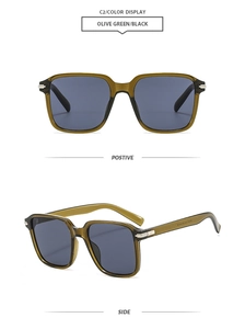Detail view of olive green oversized square sunglasses with dark lenses and silver metal hinges