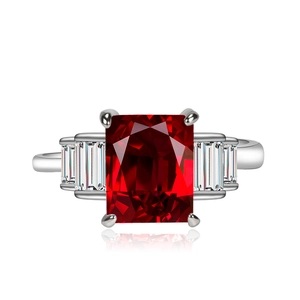 Luxury emerald-cut pink zircon ring with shimmering side stones on polished silver band