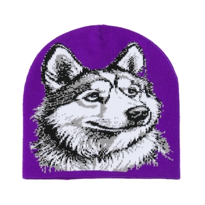 Close-up of purple knit beanie featuring a sharp jacquard husky wolf pattern