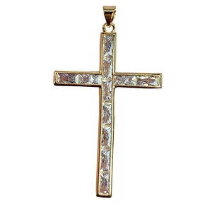Golden cross pendant with rectangular cubic zirconia stones in track setting on white background