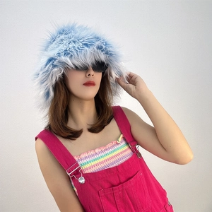 Close-up of fluffy faux fur bucket hat in light blue and white color mix for women