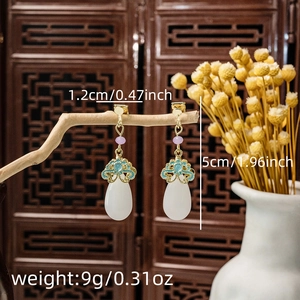 Detail shot of vintage Chinese pearl tassel earrings with precise size and weight data