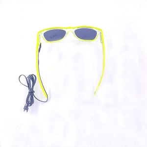 Detail view of fluorescent yellow LED glasses with EL wire and UV400 certification sticker