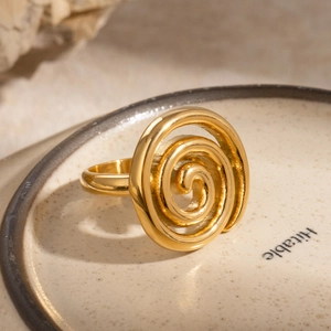 Minimalist golden stainless steel spiral ring with a unique threaded swivel design