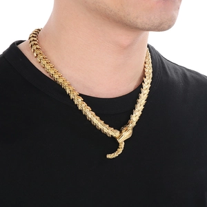 Golden stainless steel snake bone chain necklace with dragon scale texture on model