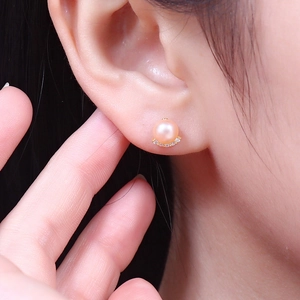 Elegant S925 silver stud earrings featuring a pink freshwater pearl with crescent zircon accents