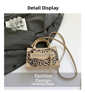 Top view of leopard print crossbody bag with beige leather trim and zipper detail