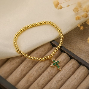 Luxurious gold-plated beaded cross bracelet with green and white zircon on silk fabric
