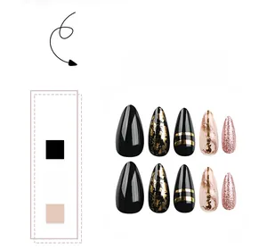 Detail of almond-shaped press-on nails with gold foil, black glitter, and rhinestone accents