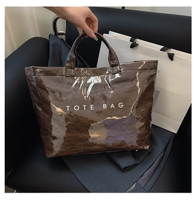 Brown Dupont paper tote bag with TOTE BAG print and glossy wrinkled texture