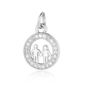 Detailed view of silver circular pendant with boy and girl silhouette and white zircons