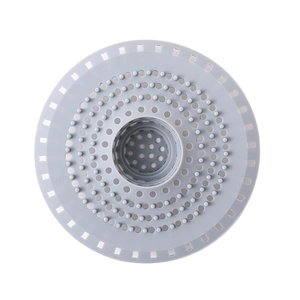 Gray silicone sink strainer with circular holes and hair filter for drainage