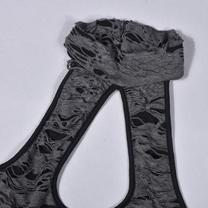 Detailed view of dark gray distressed knit fabric with ripped design and black trim neck