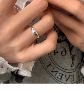 Close-up of S925 sterling silver smile face ring with engraved letter details