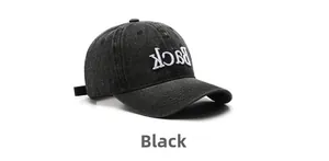 Detailed view of black washed denim baseball cap with white Back embroidery texture
