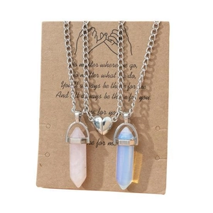 Detail of magnetic heart clasp on hexagonal crystal pendant necklaces for couples and friends