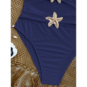 Navy blue strapless swimsuit with cutout waist and gold starfish metallic accents