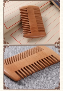 Close-up of double-sided peach wood comb featuring wide and fine teeth for hair care