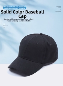 Classic black ponytail baseball cap with curved brim shown in a sunny outdoor setting