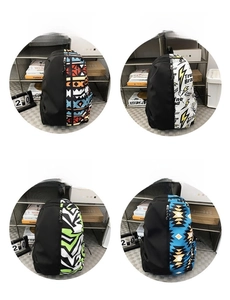 Detail view of large school backpacks in four distinct patterns and mixed color designs