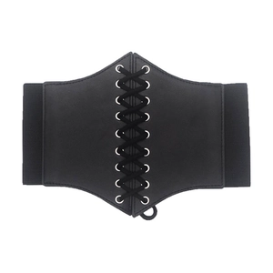 Close-up of black wide corset belt featuring lace-up metal eyelets and elastic band