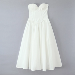 Detail of white strapless corset dress with decorative bow and structured bodice