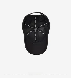 Detail of black baseball cap interior with FARD logo lining and adjustable metal buckle