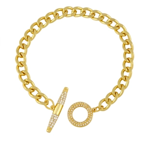 Golden Cuban chain bracelet featuring a sparkling zircon pavé OT buckle on white background